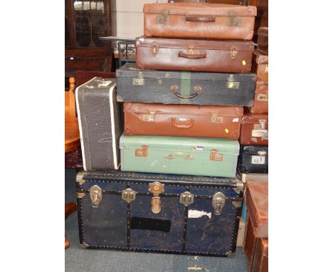 A blue metal cabin trunk, Noton and Phoenix suitcases, and four further suitcases, (7).