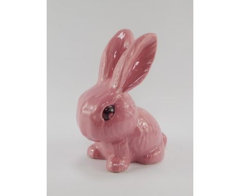 A Sylvac pink glazed seated rabbit, impressed marks, 21cm high.