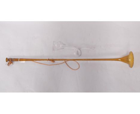 A Victorian fluted amber glass post horn, 89.5cm long, and a fluted clear glass hunting horn, 30cm long, (2).