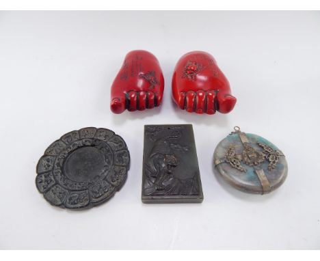 A Chinese hard stone calendar disk, 8cm diameter, jade carving of a tiger, hard stone and white metal Buddha pendant, and a p