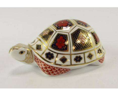 A Royal Crown Derby porcelain Imari paperweight modelled as a tortoise, gold button.