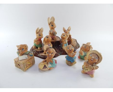 Ten Pendelfin Rabbits, and a Beswick tree trunk stand, (11).
