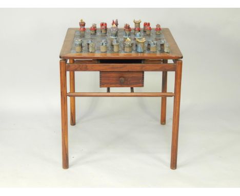 A Danish rosewood and ceramic tile inlaid chess table by Poul Hundevad, late 1960's, with two opposing frieze drawers, raised