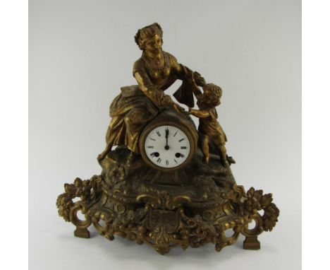 A French late 19thC gilt spelter mantel clock, circular enamel dial bearing Roman numerals, eight day movement with bell stri