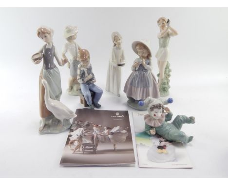 A Lladro porcelain figure of a girl feeding a goose, another of a girl with a candlestick, and five Nao figures, (7).