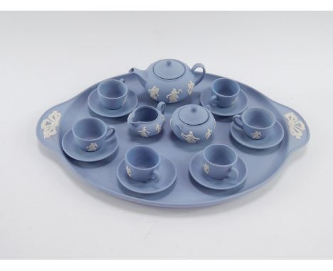 A Wedgwood light blue Jasper Dancing Hours miniature tea set, limited edition for Danbury Mint, with certificate.