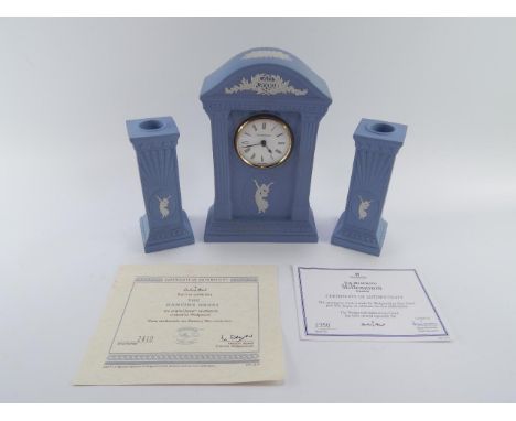 A Wedgwood light blue Jasper Millennium clock, and a pair of candlesticks, limited edition, for Danbury Mint, with certificat