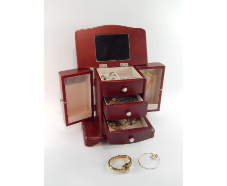 A jewellery chest containing silver and gem set rings, necklaces, chains, earrings and a panther bangle.