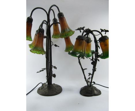A Tiffany style cast metal six branch table lamp, embossed with dragonflies, coloured glass trumpet shades, 63cm high, and a 