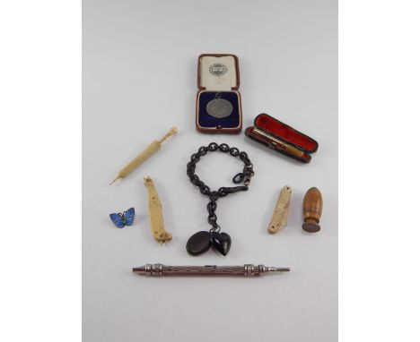 A Victorian jet bracelet, bone Stanhope carved as a parasol, Views of Windsor, silver and enamel butterfly brooch and sundry 