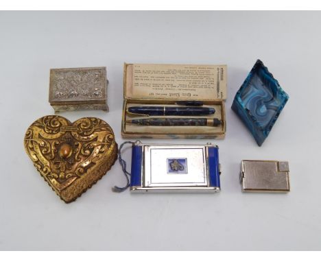 A French gilt brass heart shaped box, Dunhill plated pocket lighter, monogram engraved, Conway Stewart pen and pencil set, bo