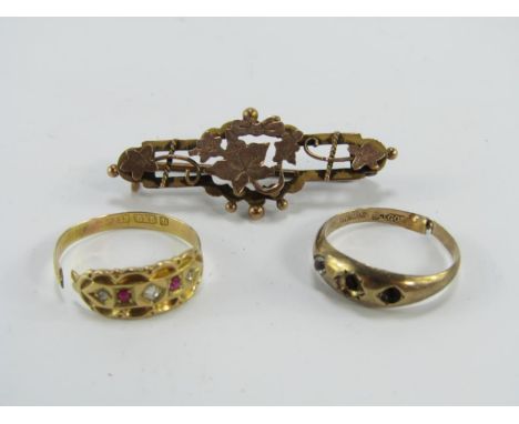 A 15ct gold ruby and diamond old cut five stone ring, 1.8g, gypsy ring, marked 9ct, 0.6g, and a 9ct gold two colour leaf broo