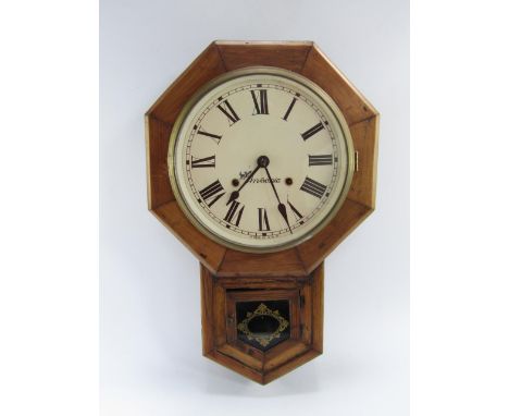 An Ansonia walnut and oak drop dial wall clock, early 20thC, cream painted circular dial bearing Roman numerals, eight day mo