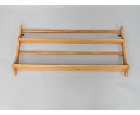 An Ercol oak two tier plate rack, wall mounted, 96.5cm long.