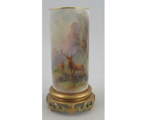 A Royal Worcester cylindrical shaped vase, finely painted with a stag and a hind in a wooded landscape by Harry Stinton, rais