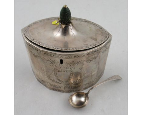 A Georgian silver tea caddy, of octagonal form, with engraved floral swags and leaf border, with pineapple finial, ,together 