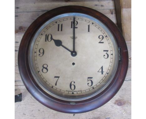 A circular mahogany framed wall clock, by Smiths, together with a circular wall clock, with barometer and a small rectangular