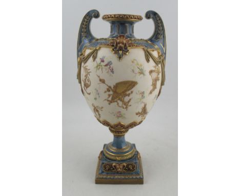 A Royal Worcester Hadleys style pedestal vase, decorated with coloured flowers, gilded fans, harps and swags to a gilt ivory 