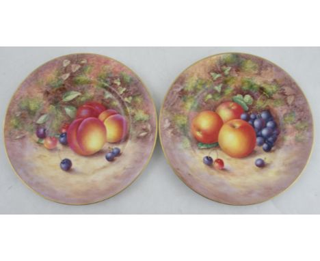 A pair of Royal Worcester porcelain plates, decorated with hand painted fruit by Freeman, diameter 9.25ins&nbsp;Condition Rep