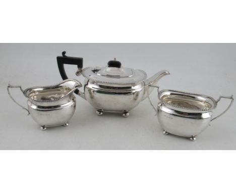 An Elkington &amp; Co silver three piece tea set, with gadrooned edge and ball feet, weight 32oz all in
