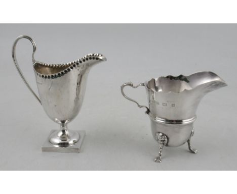 A silver helmet shaped cream jug, together with another silver jug, weight 5oz