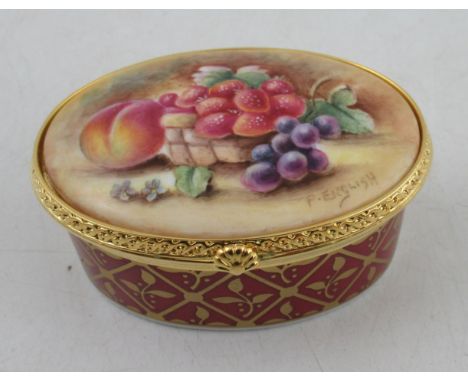 An oval Royal Worcester pill box, the hinged cover decorated with fruit to a mossy background by English, diameter 2.75insCon