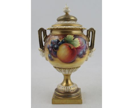 A Royal Worcester covered pedestal vase, decorated all round with fruit to a mossy background by P English, shape number 2363