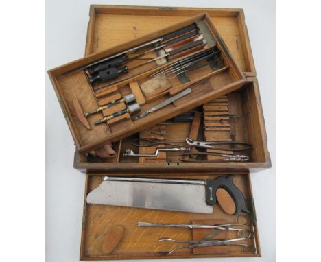 An Early 20th Century/ World War Field Surgeon’s Set, in oak brass bound case, with interior tray and containing numerous too