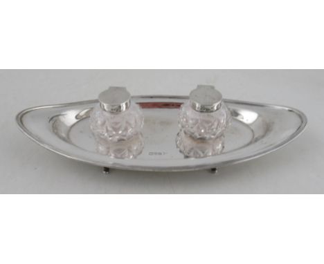 A Walker &amp; Hall oval silver desk stand, fitted with two glass inkwells, weight 5oz