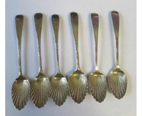 A matched set of six Georgian silver teaspoons, with bright cut decoration to the handle and shell bowls, all of various Lond