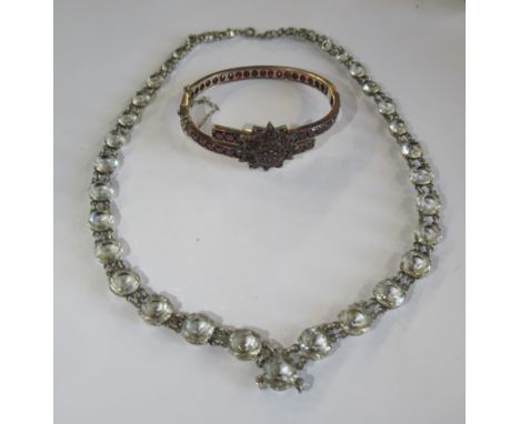 A Victorian silver gilt garnet bracelet, having star motif to the front, set numerous flat cut garnets, together with an Edwa