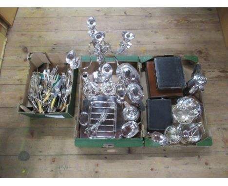 Three boxes of assorted silver plate to include four branch candelabra , tea set , jersey jug, flatware etc