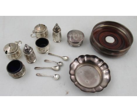 A collection of silver to include, a Mappin &amp; Webb dish, a ring box, a six piece condiment set and a bottle coaster with 