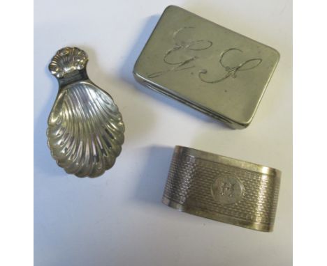 A modern silver caddy spoon, with shell finial and bowl, Birmingham 1971, together with a hallmarked silver oval napkin ring,