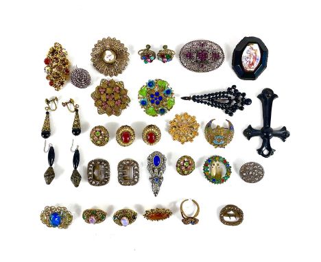 A selection of costume jewellery. Including Czech brooches, earrings, cut steel buckles, jet cross and brooch etc.The cross i