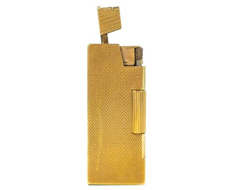 A 9ct gold Rollboy lighter by A D Bach. Engine turned decoration to all sides and one panel sliding to reveal the gas valve a