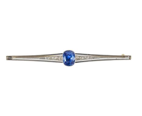 A fine early 20th century 15ct and platinum blue sapphire and diamond bar brooch. The cushion cut sapphire measuring 4.5ct ap