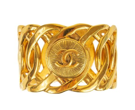 A Chanel CC medallion wide cuff bangle. 1980's, stamped CHANEL MADE IN FRANCE, diameter 7cm width 4.5cm.Some light surface sc