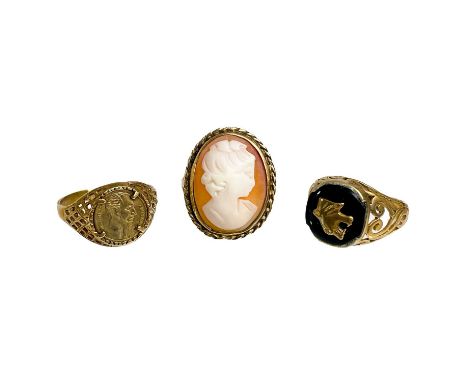 Three 9ct gold rings. One set with onyx, size N, another with a cameo, size P 1/2 and one set with a small medalion, size R 1