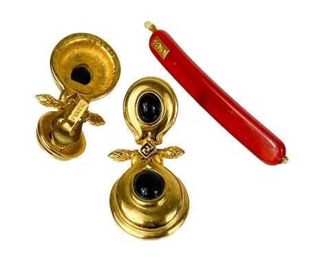 A pair of Fendi gold plated clip-on earrings. Stamped FENDI twice, length 50mm; together with a Fendi hair clip.Both good vin