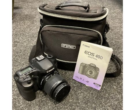 A Canon EOS 40D digital camera with canon 18-55mm f3.5-5.6 lens, with camera bag, charger, and spare battery. 