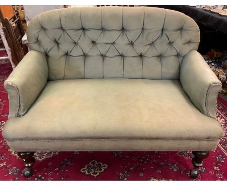 A late Victorian button back two seat sofa, turned mahogany legs, 118cm wide x 65cm deep. 