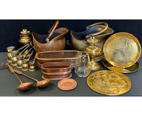 A 19th century copper coal scuttle;  another;  oil lamps, pair of copper ladles, planter etc 