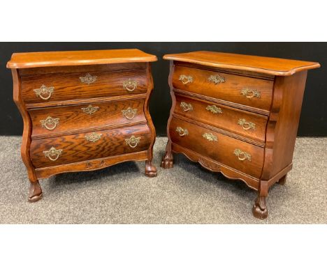 A near pair of French oak bedside commode chests, shaped rectangular tops, three drawers, carved feet, each measuring 65cm ta