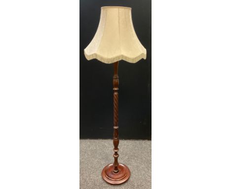 A Victorian style mahogany standard lamp, turned and spirally fluted column, disc base, 178cm tall with shade. 