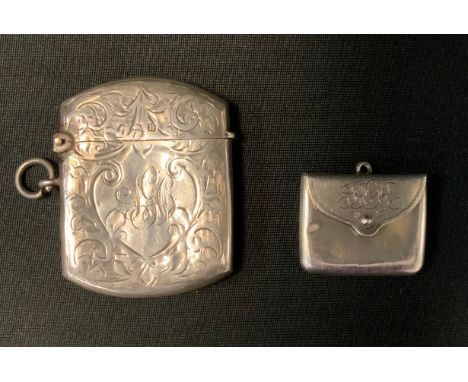 A silver vesta case, engraved and chased with foliage scrolls, Birmingham 1912;  a novelty silver stamp box, in the form of a