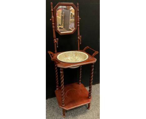 An early 20th century two tier washstand, octagonal mirror above canted square top inset F Wileman washing bowl, turned barle