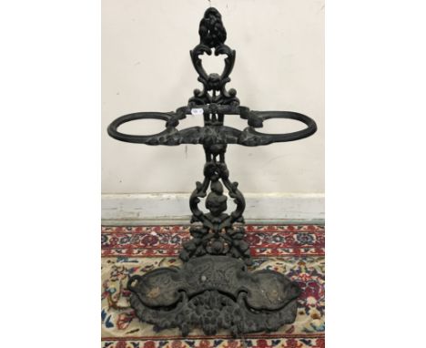 A cast iron foliate and floral decorated stick stand, 67cm high 