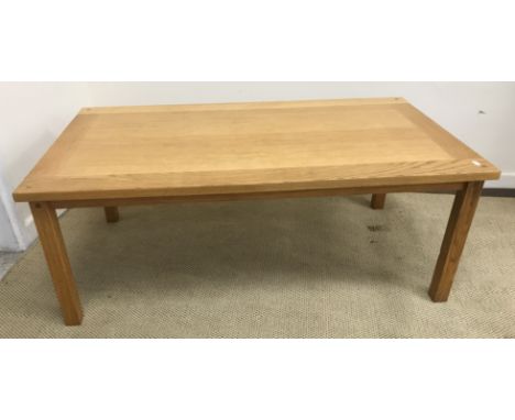 A modern oak rectangular coffee table, 118 cm wide x 66.5 cm deep x 45.5 cm high, a low oak side table, the rectangular top o