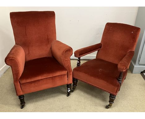 A Victorian upholstered open arm chair on turned and ringed front legs to brass caps and castors, stamped to rear leg "M Doyl